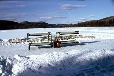 morelli crouched between bunk beds